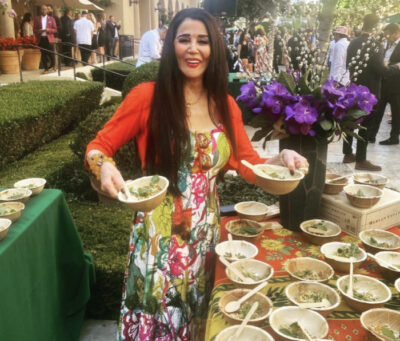Barbara Lazaroff serving a Spago salad at the Beverly Hills Chamber of Commerce Summer Garden Party 2022.