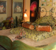 Closer view of the book shaped bed with a story on it and the images above the bed. Closer view of the book shaped bed with a story on it and the images above the bed.